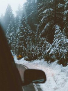 winter driving beside snow bank